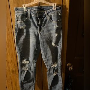 Ripped blue jean pants